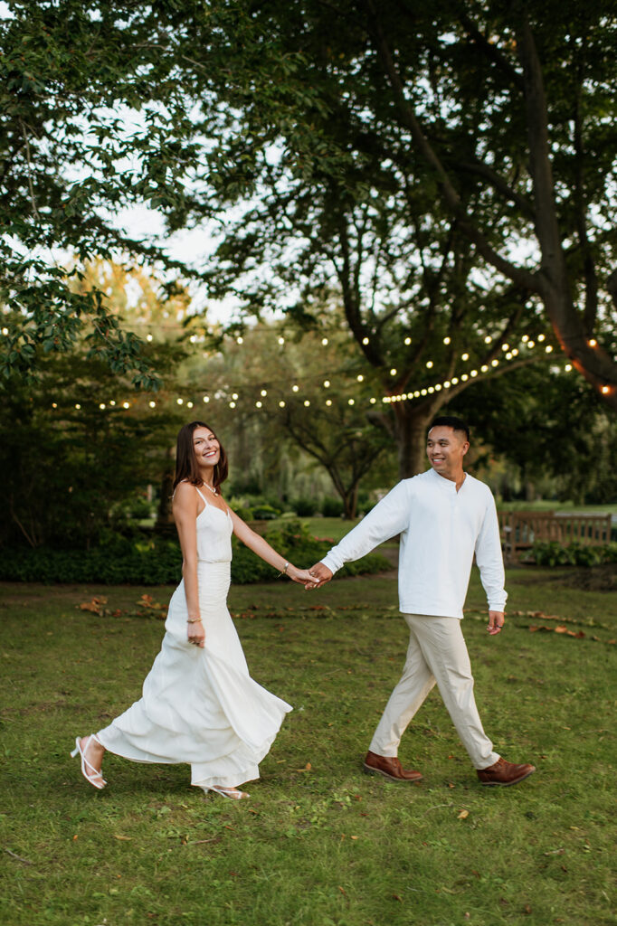 Couple walking across the lawn for their Saint Mary’s College session.