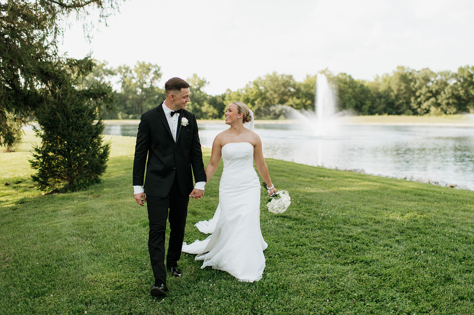 Outdoor bride and grooms portraits on the grounds at The Clubhouse wedding venue in Indiana