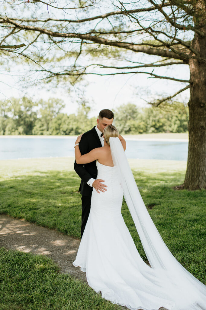 Bride and groom sharing a kiss after their first look at The Clubhouse Venue.