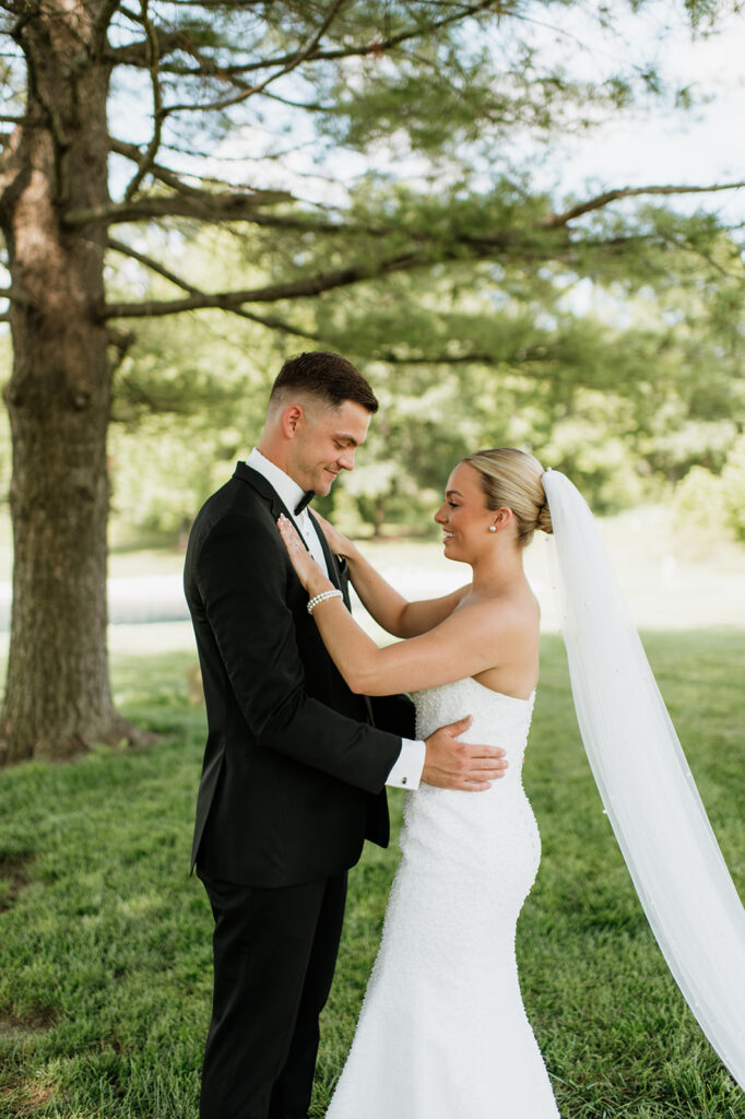Bride admiring the grooms look after during their first look at The Clubhouse Venue.