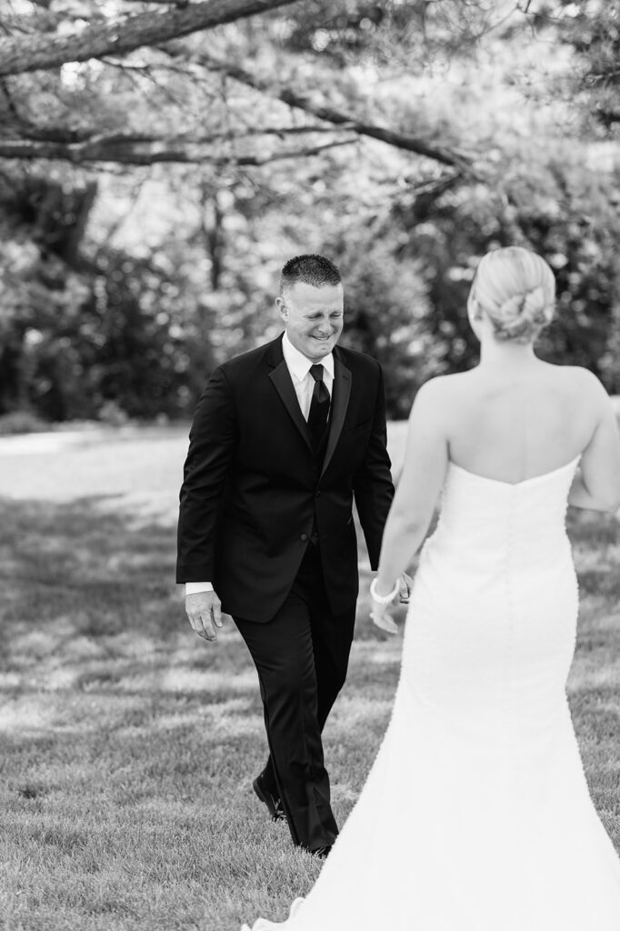 Emotional first look between bride and her father outside The Clubhouse Venue.