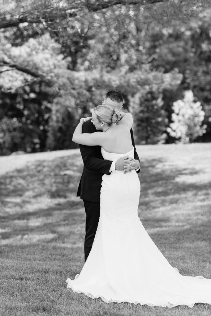 Emotional first look between bride and her father outside The Clubhouse Venue.