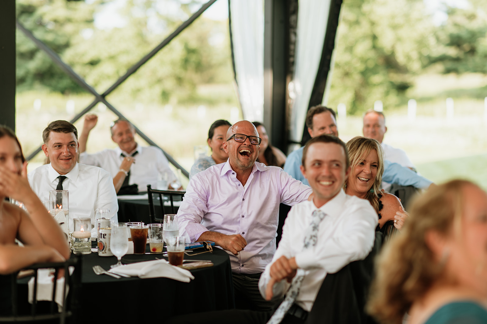 Guests laughing during speeches