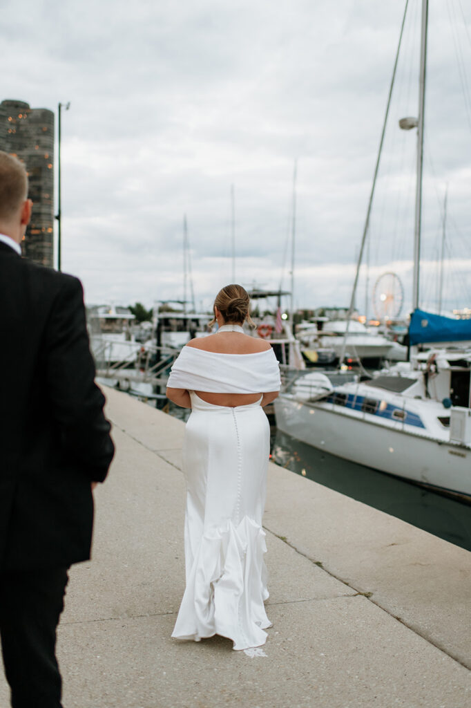 Bride and groom walking along the dock in Chicago.