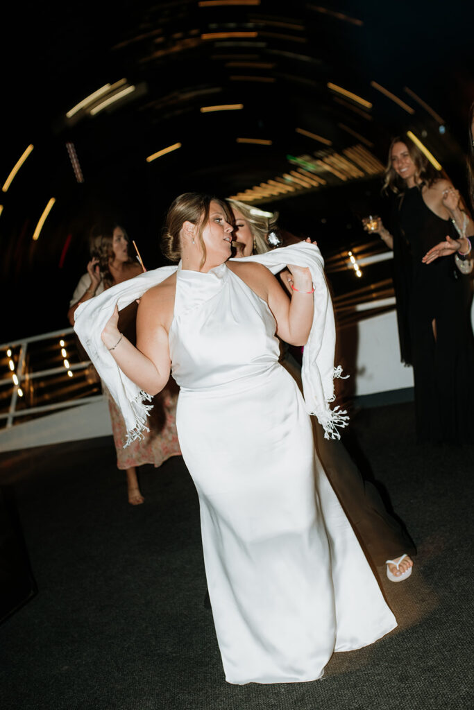 Bride dancing on the Anita Dee II during a Chicago yacht wedding reception.