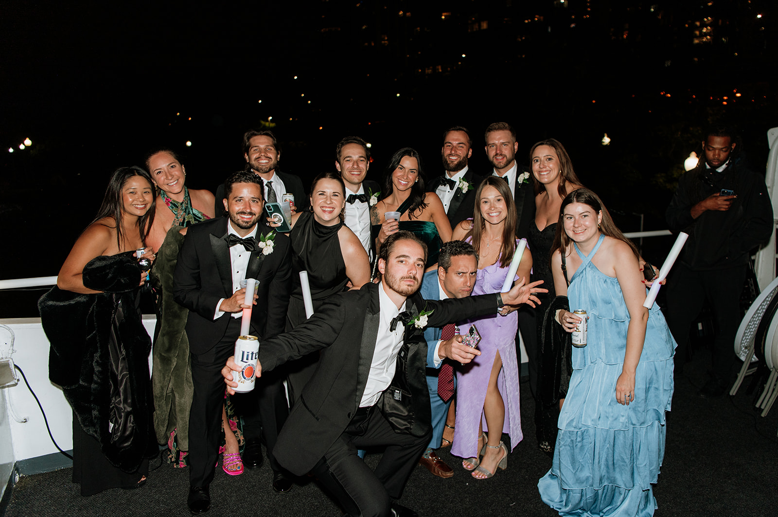 Guests posing for a photo on the Anita Dee II during a Chicago yacht wedding reception.