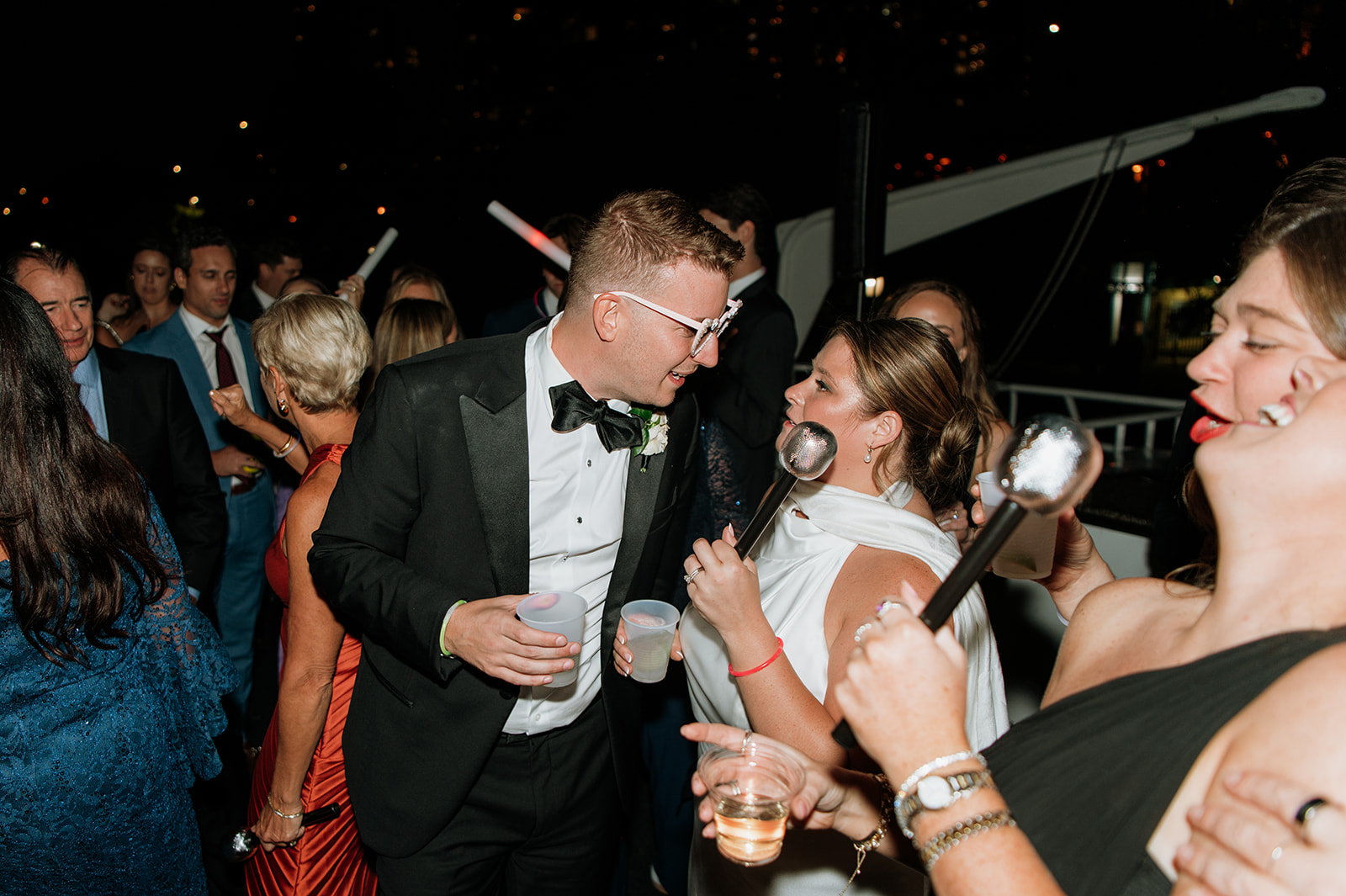 Bride and groom having fun on the Anita Dee II during a Chicago yacht wedding reception.