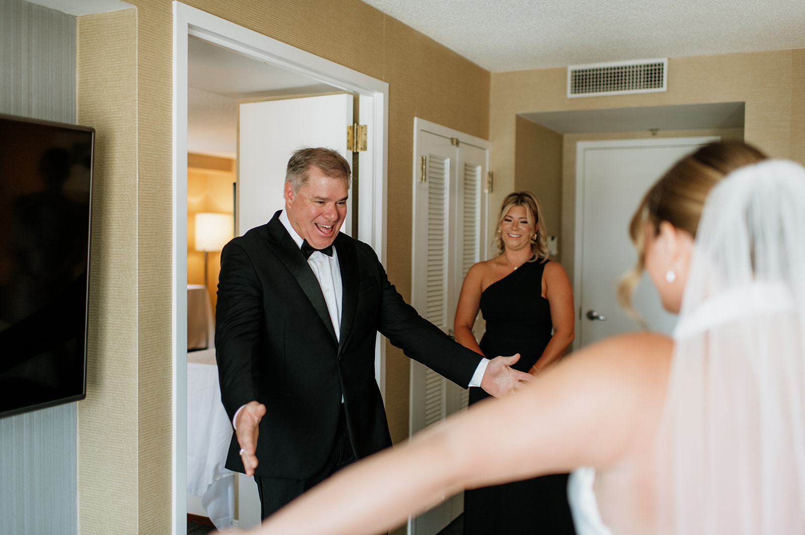 Father seeing the bride for the first time during wedding morning preparations.