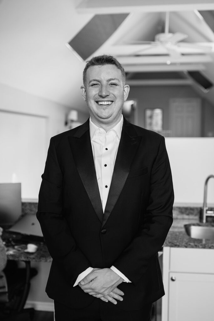 Black and white indoor portraits of a groom from a Chicago wedding.