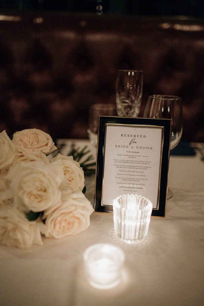 Table details with florals and candlelight at a Tortoise Supper Club wedding in Chicago.