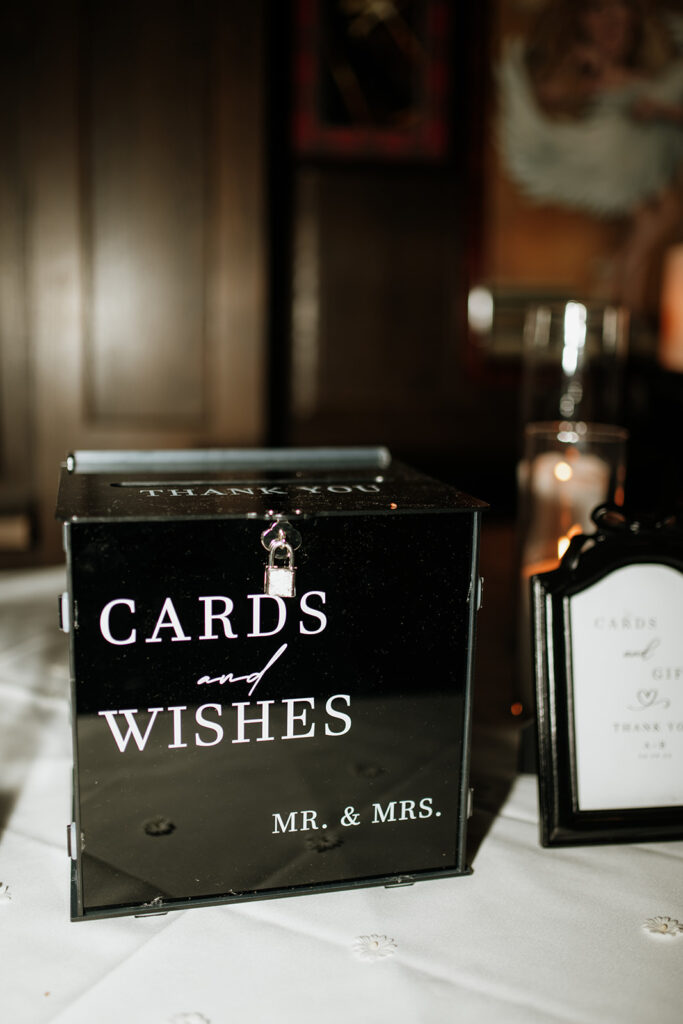 Cards and wishes wedding table set up.