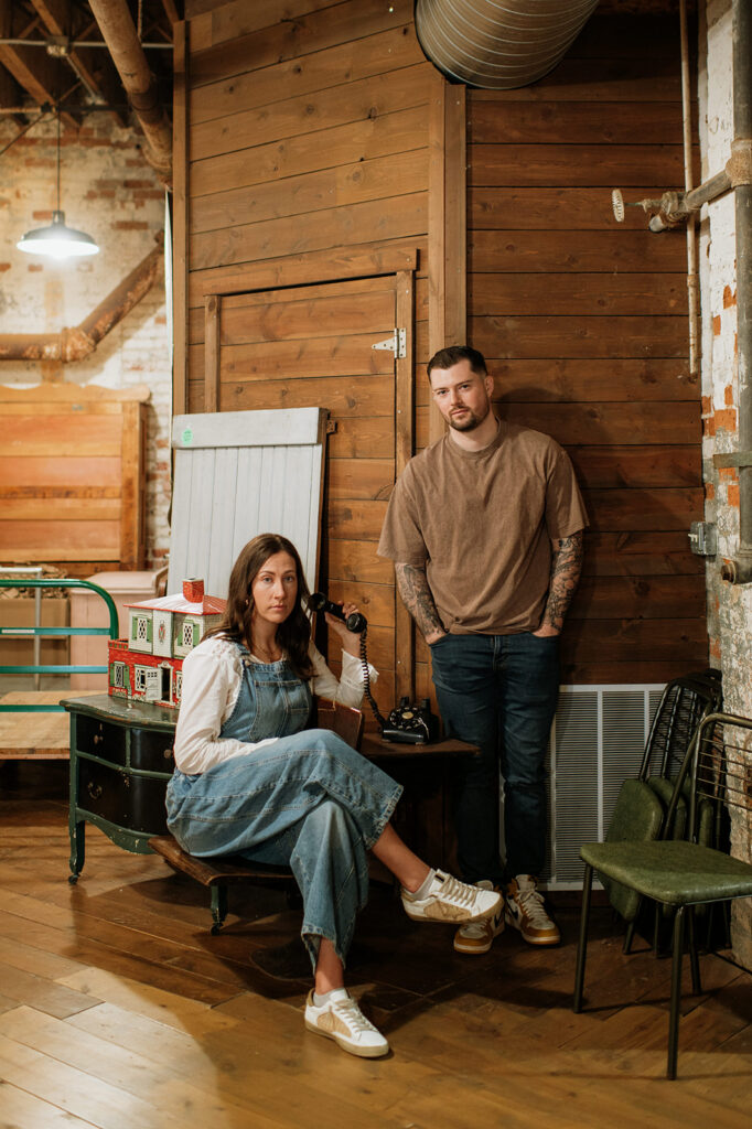 Bride-to-be sitting and holding vintage phone.