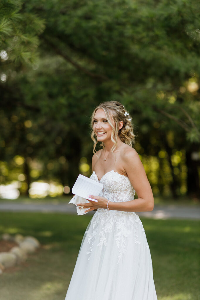 Bride holding her vow book during her private vows at The Lodge at Rush Lakes in La Porte, Indiana.