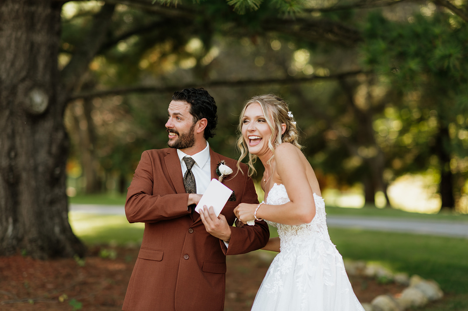 Bride and groom laughing as they exchange vows.