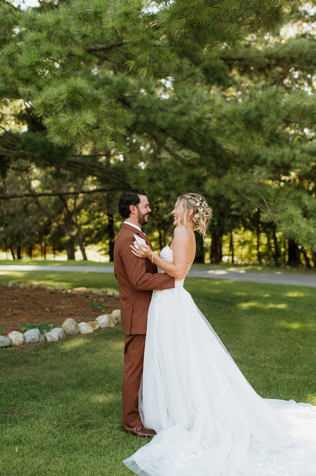 Bride and groom laughing and hugging after exchanging private vows at The Lodge at Rush Lakes. 