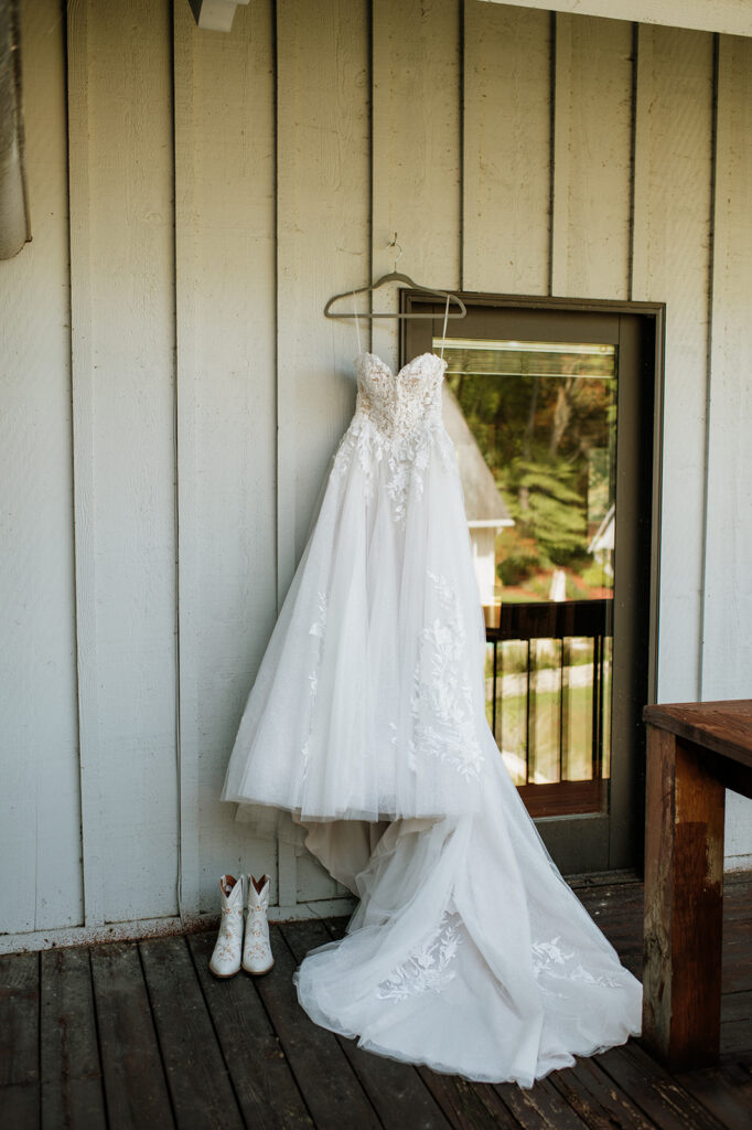 Brides wedding dress and boots at The Lodge at Rush Lakes. 