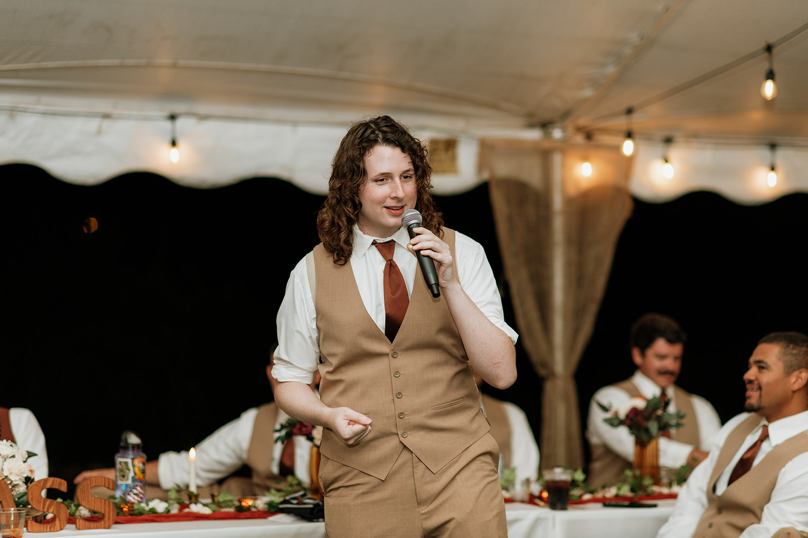 Groomsmen giving a speech during the reception.