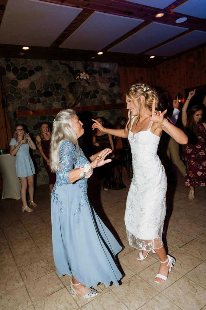Bride dancing with her mother in law.
