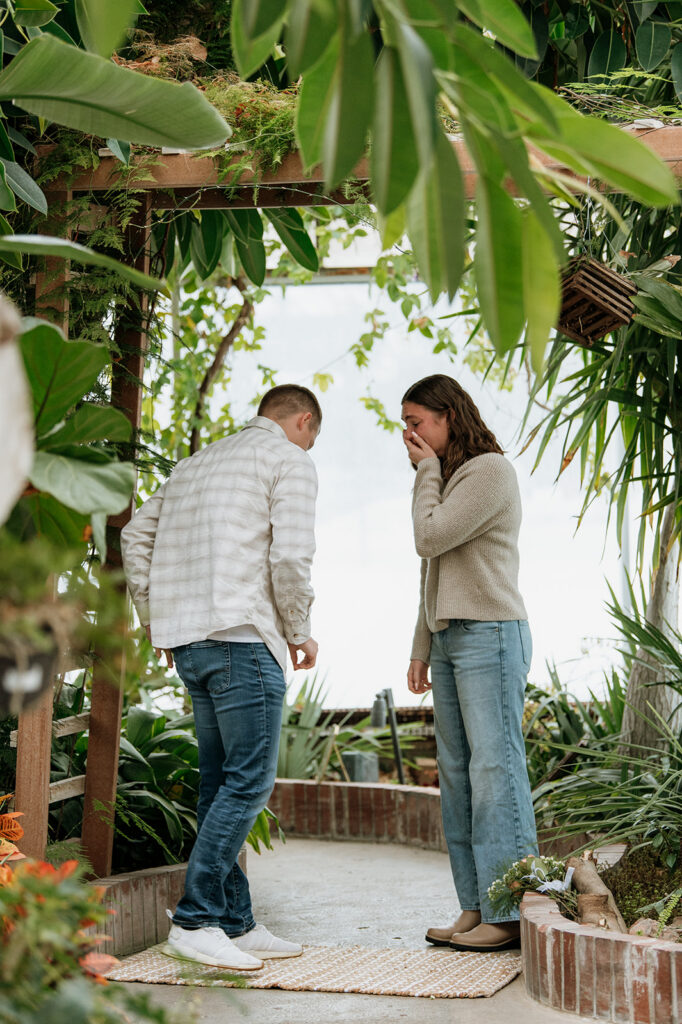 Woman in shock as she realizes she's about to be proposed to. 