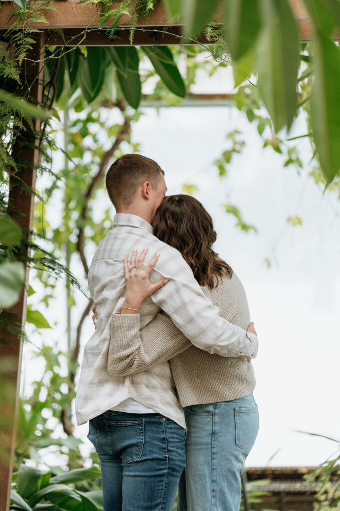 Couple hugging after their surprise proposal in South Bend, Indiana. 