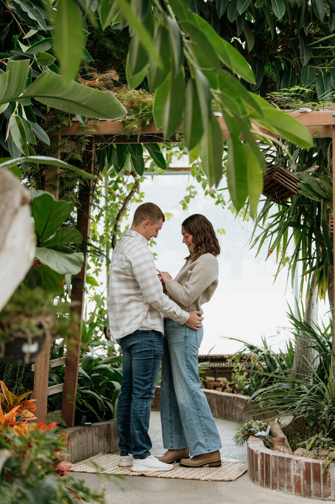 Woman admiring her engagement ring after their surprise proposal in South Bend, Indiana. 