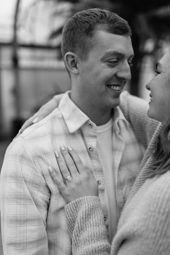 Intimate close-up of couple embracing after South Bend Indiana surprise proposal indoors.