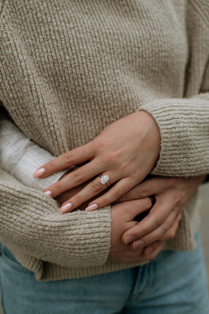 Detail of engagement ring on hand during South Bend Indiana surprise proposal session.