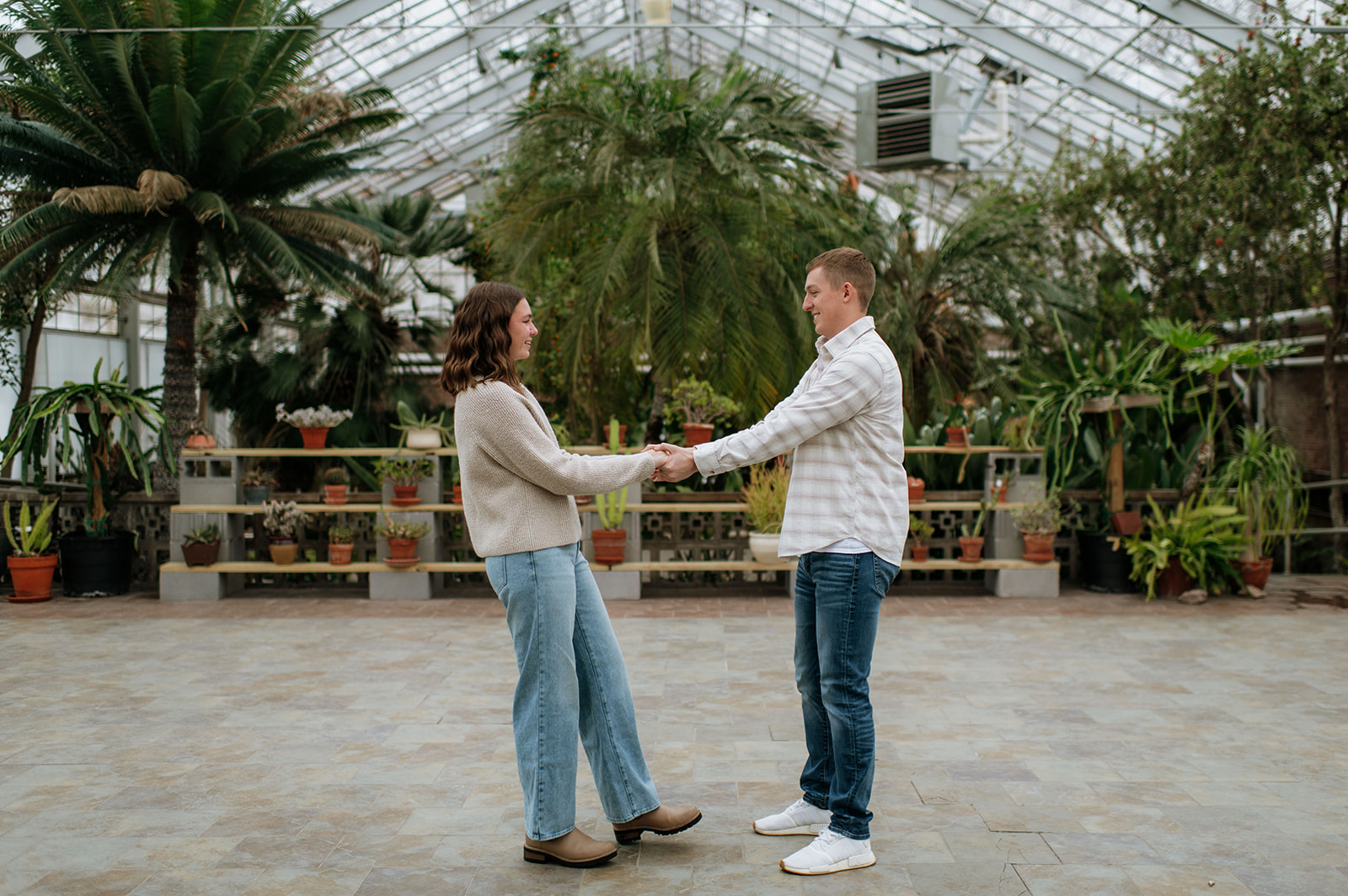 Couple holding hands at Potawatomi Conservatories.