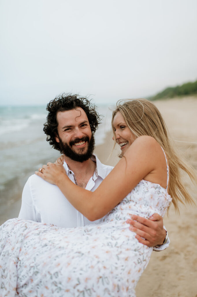 Couples summer engagement photos on the beach.