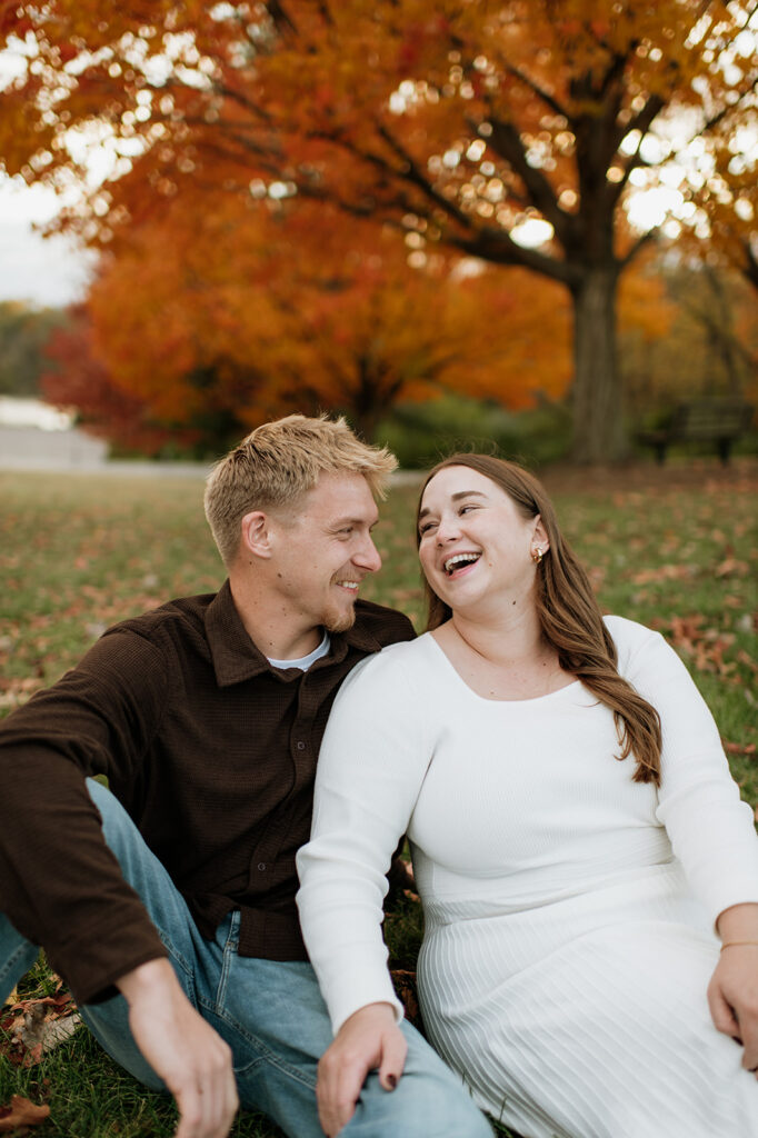Candid photo of a couple laughing during their photo session.