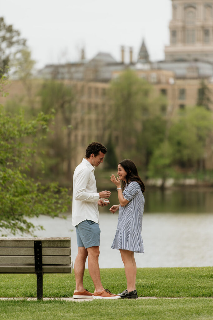 Woman crying after her Notre Dame proposal in front of Saint Joseph's Lake.