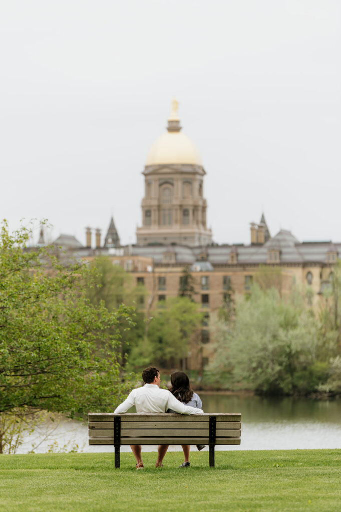 Couples sitting on a bench at Saint Joseph's Lake.