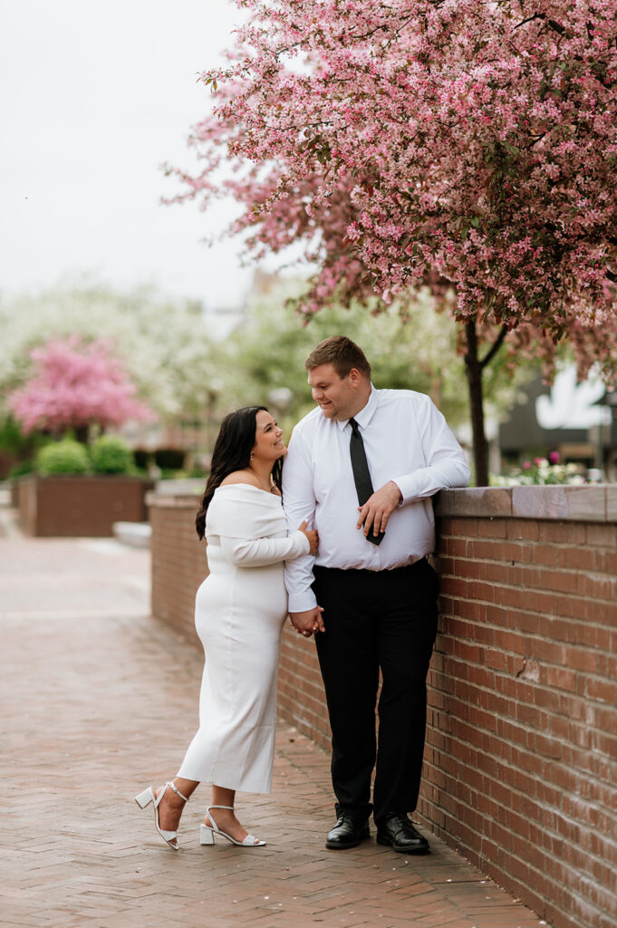 Couple posing outside of Morris Performing Arts Center for their South Bend engagement photos.
