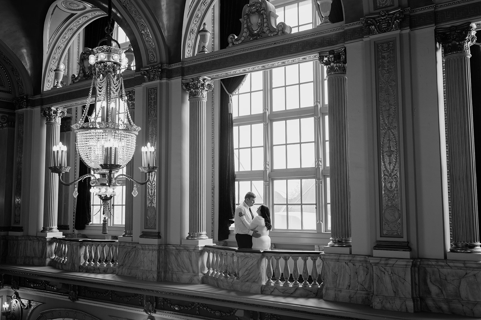 Black and white photo of a couple posing for engagement photos at Morris Performing Arts Center - a Northern Indiana Photo Location.