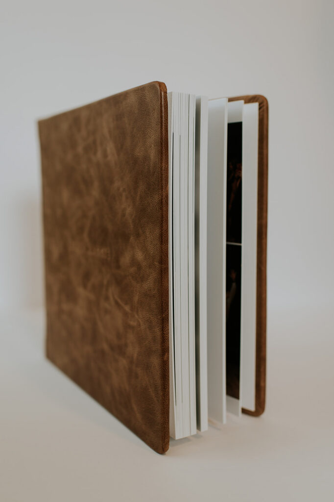 Leather wedding album sitting on its side.