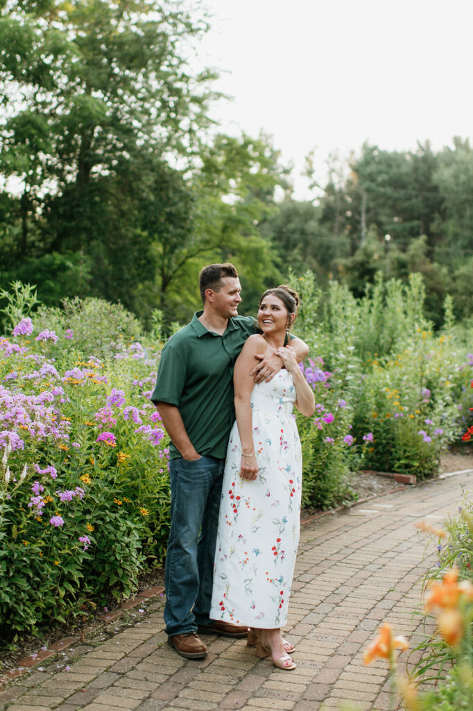 Couple posing on a garden pathway in Defries Gardens in New Paris, Indiana.