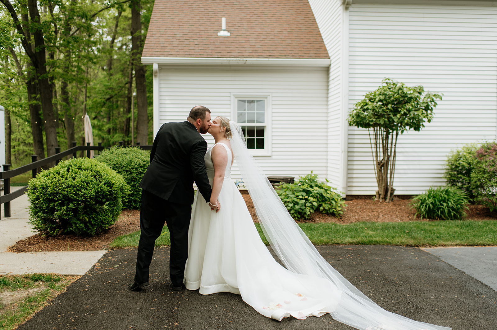 Bride and groom kissing outside of the chapel at The Morris Estate in Niles, Michigan.