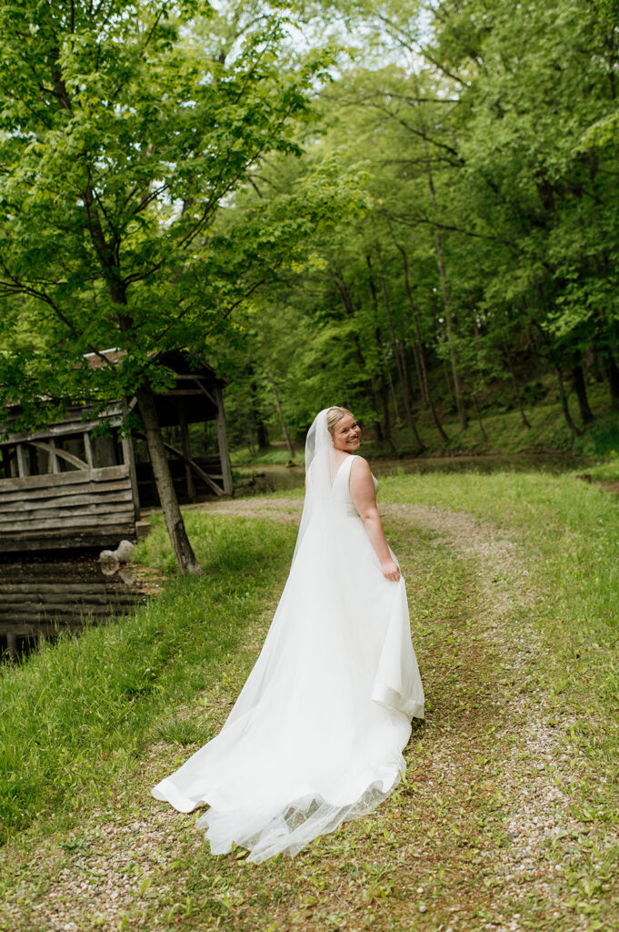 Bride walking towards the covered bridge at The Morris Estate in Niles, Michigan.