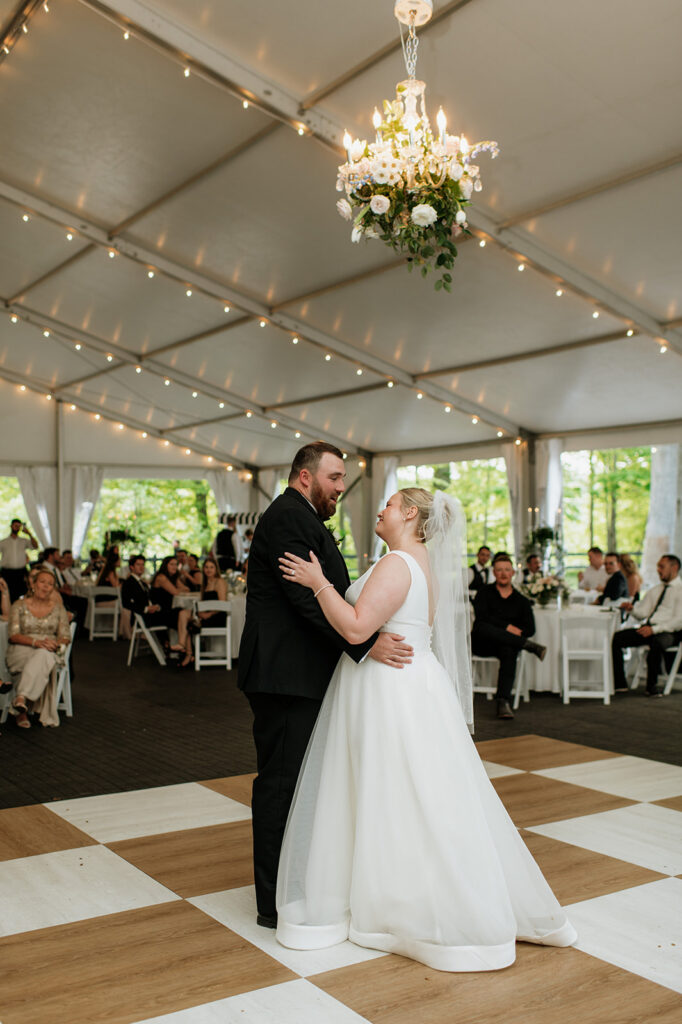 Bride and groom dancing during their Morris Estate tented wedding reception.