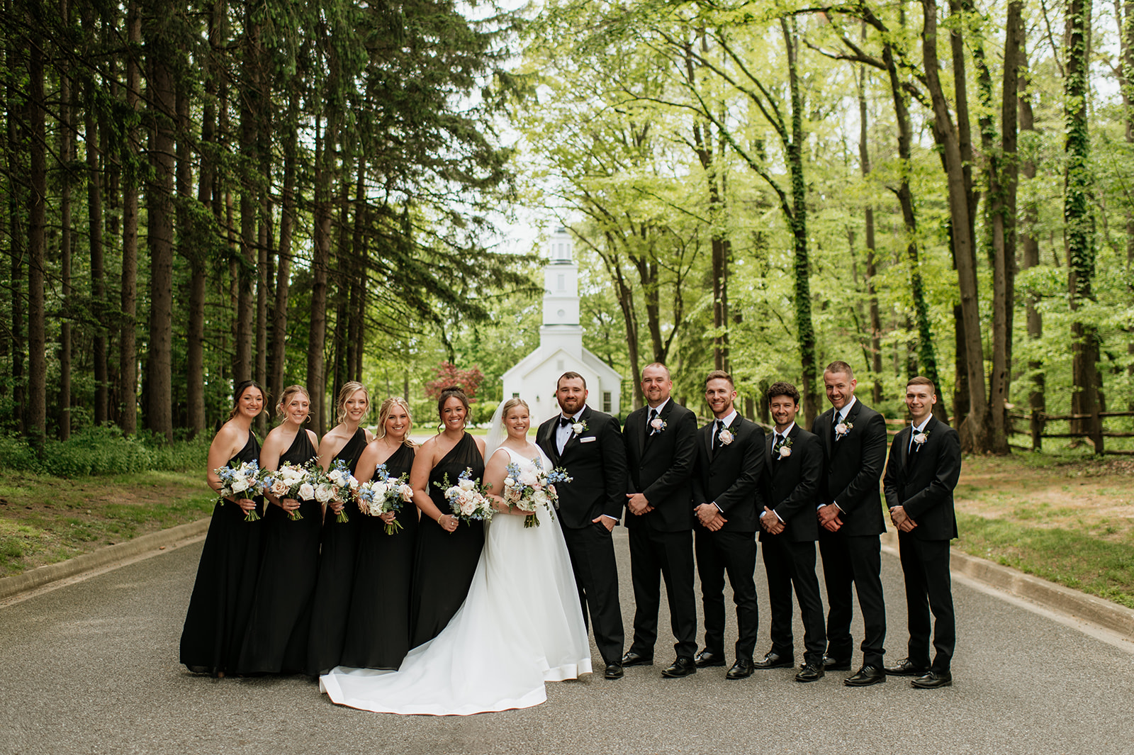 Wedding party photos on the three-lined road at The Morris Estate in Niles, Michigan.