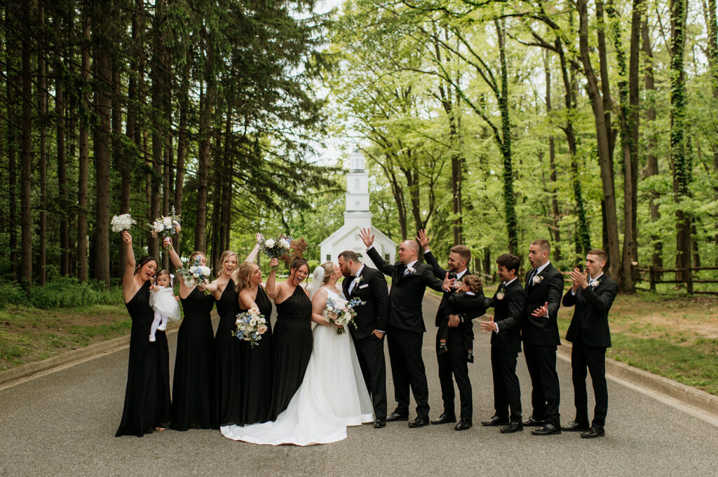 Full wedding party group shot in front of The Morris Estate Chapel in Niles, Michigan.